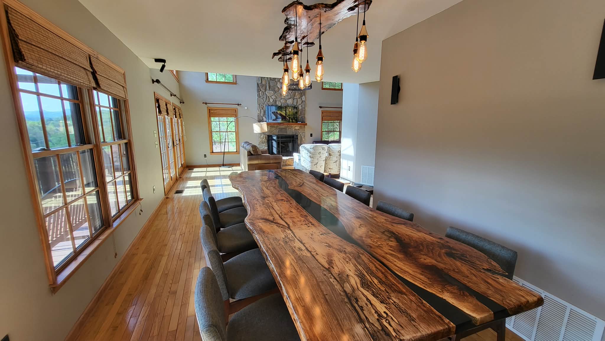 Dining room with live-edge river table and chandelier