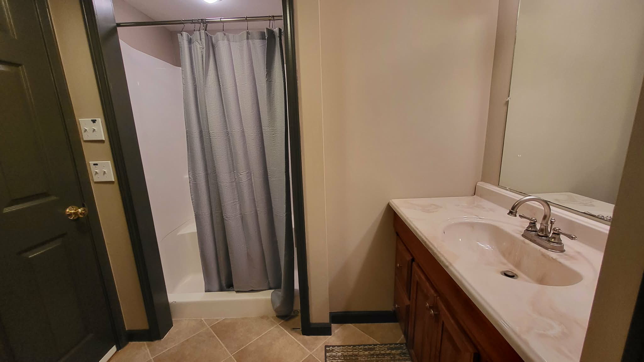 Full bathroom on the lower level near the bunk room