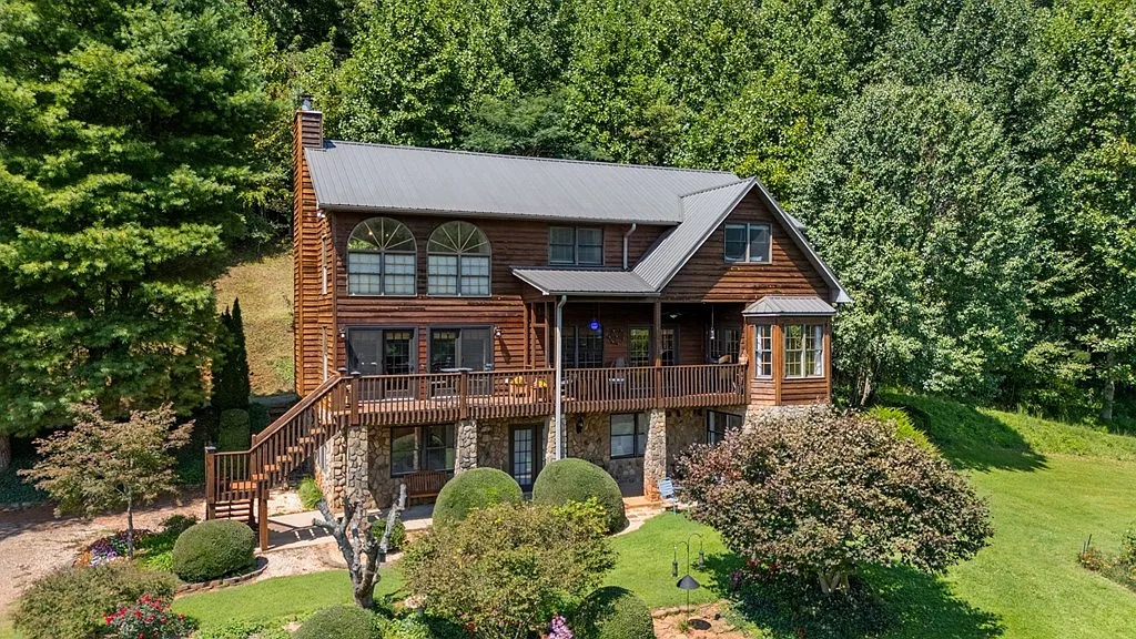 Drone view of the estate showing stone foundation and multi-level architecture